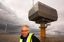 Doug Parr, chief scientist for Greenpeace UK, at Gunfleet Sands offshore wind farm which  is owned and operated by Dong energy. Brightling Sea, Essex, UK. September 2015