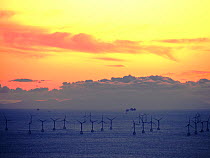 An Irish sea gas platform and wind turbines in the Irish sea from Black Coombe in the Lake district, Cumbria, UK. November 2012