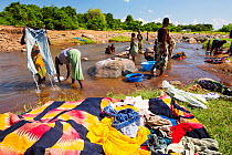 Women washing clothes in a river near Chikwawa in the Shire Valley, Malawi.