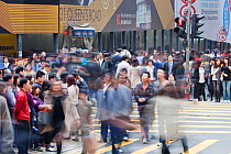 Crowds of people on the street in Hong Kong, China. Hong Kong is one of the most densely populated parts of the planet. February 2010.