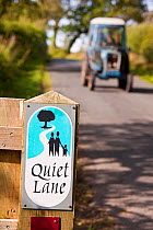 Quiet lane in the Hodder Valley in Lancashire, England, UK. This  initiative encourages motorists to drive slowly as the road is used by walkers and cyclists.