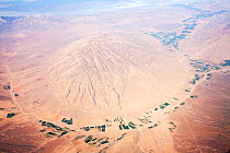 Aerial view showing desert landscape and irrigated fields, Iran, March 2009.