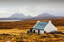 Remote crofting house on Rubha Coigeach, looking towards Stac Pollaidh. Assynt, North West Highlands, Scotland, UK, October 2013.