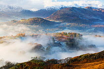 View down into the Langdale Valley above valley mist formed by a temperature inversion on Loughrigg, near Ambleside in the Lake District National Park, England, UK, December 2014.
