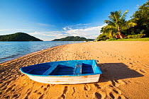 Boat on a beach at Cape Maclear, Lake Malawi, Malawi, Africa. March.
