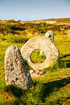 Men an Tol stone near St Just in Cornwall, UK. This late Neolithic monument is thuoght to have been part of a now disappeared stone circle or an entrance to an old burial chamber