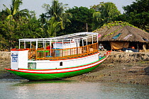 Boat in the Sunderbans, Ganges, Delta, India. December 2013. This area is very low lying and vulnerable to sea level rise.
