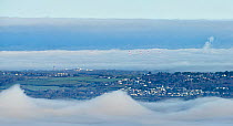 Kelvin-Helmholz clouds forming over the Eastuary of the River Dee and the Wirral Peninsular, December. These waveform clouds are caused by shear between air above moving at a different speed than belo...