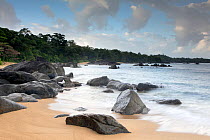 Beaches along the coast of the Bay of Angotil. Scattered eroded rocks and fringed with primary rainforest. Masoala National Park, North eastern Madagascar. August