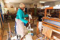 Weaver working mohair wool from Angora goats at Leribe Craft Center, Lesotho, July 2017.