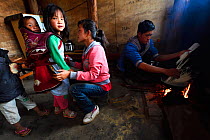 Local people cooking Xiang Bai Lisu village, Tongbiguan Nature Reserve, Dehong Prefecture, Yunnan province, China, May 2017.