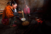 Family cooking in  Xiang Bai Lisu village, Tongbiguan Nature Reserve, Dehong Prefecture, Yunnan province, China, May 2017.