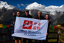 Wild Wonders of China team in front of Bawu Bameng, 6000 m, along the pilgrimage route around Meili Snow Mountain, 6740 m, a Sacred mountain for Tibetan Buddhists, Yunnan, China, October 2017.