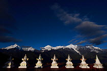 Stupas in Feilaisi, in front of Meili Snow Mountain, 6740 m, a Sacred mountain for Tibetan Buddhists, Yunnan, China, October 2017.