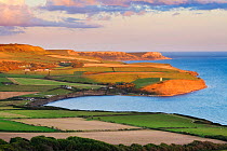 View over Kimmeridge Bay with Clavell Tower in distance, Isle of Purbeck, Dorset, England, UK. August 2011.