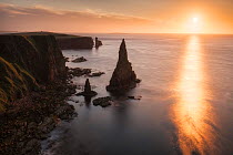 Duncansby Stacks and Duncansby Head with Orkney Islands in distance, John O'Groats, Caithness, Scotland, UK. August 2014.