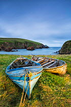 Boats on shore with Muckle Sound in background, Scousburgh, Shetland, Shetland Islands, Scotland, UK. July, 2014.