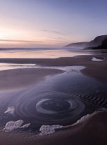 Sandymouth Bay beach and water motion, late evening light, near Bude, Cornwall, UK. April 2015.