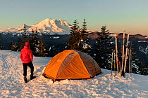 Winter campsite on Suntop Mountain in the Baker-Snoqualmie National Forest. Washington, USA. March. Model released.
