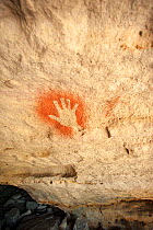 19,000 year-old Aboriginal rock painting of a hand on sandstone, Cania Gorge National Park, Queensland, Australia. September 2016.