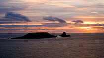 Timelapse of the sun setting over Worms Head, Gower Peninsula, Wales, UK, May 2016. Hellier