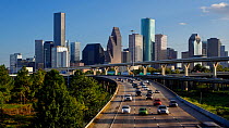 Timelapse of traffic on a highway, with Houston skyline in the background, Texas, USA, June 2016. Hellier