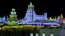 Timelapse from day to night of people visiting the illuminated ice sculptures at the Harbin Ice and Snow Festival, Heilongjiang Province, China, February 2015. Hellier