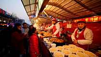 Street food vendor, Donghuamen Night Market, Wangfujing, Dongcheng District, Beijing, China, February 2015. Hellier
