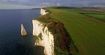 Aerial view tracking in reverse along the chalk cliffs near Old Harry Rocks, Dorset, England, UK, June 2017. Hellier