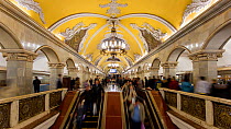 Timelapse of commuters using escalators in Moscow's Komsomolskaya metro station, showing vaulted ceiling and chandeliers, Russia, May 2016. Hellier