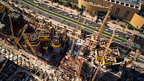 Timelapse looking down onto cranes moving on a construction site, Dubai, United Arab Emirates, January 2017. Hellier