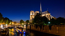Timelapse of boats on the River Seine at night, next to Notre Dame, Paris, France, May 2016. Hellier