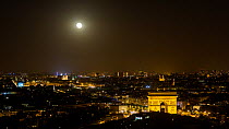 Timelapse of the moon rising over Paris at night, with the Arc de Triomph in the foreground, Paris, France, May 2016. Hellier