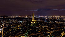 Timelapse of the sun setting over Paris and the Eiffel Tower, with lights coming on, Paris, France, May 2016. (This image may be licensed either as rights managed or royalty free.)