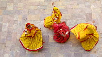 Four women dancing whilst wearing saris, Samode Palace, Jaipur, Rajasthan, India, Model and Property released, January 2018. Hellier
