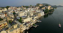 Aerial shot over Lake Pichola and the City Palace, Udaipur, Rajasthan, India, January 2018. Hellier