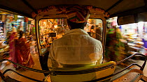 Timelapse from the back of an autorickshaw moving through city streets, Udaipur, Rajasthan, India, January 2018. Hellier