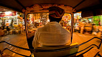 Timelapse from the back of an autorickshaw moving through city streets, Udaipur, Rajasthan, India, January 2018. Hellier