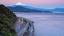 Timelapse of traffic driving on the Tomei Expressway at dusk, with Mount Fuji in the background, Shizuoka, Honshu, JapanNovember 2017. Hellier
