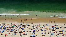 People swimming and sunbathing on Copacabana beach, Rio de Janeiro, Brazil, September 2016. Hellier