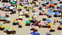 People sunbathing on Copacabana beach, Rio de Janeiro, Brazil, September 2016. Hellier