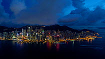 Timelapse from day to night looking towards Hong Kong harbor, Central district and Victoria Peak, Hong Kong Island, China, June 2017. Hellier