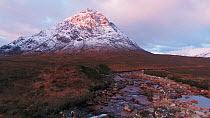 Tracking shot up the River Coupall towards Buachaille Etive Mor at sunset, Scotland, UK, October 2017. Hellier