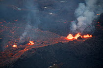 Lava emanating from Pu'u O'o, Kilauea Volcano, erupting in Leilani Estates subdivision, near Pahoa, Puna, Hawaii, USA.  June 2018.