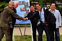 Wild Wonders of China team celebrating the Bird Love Week at the Tongchuan Crested Ibis Breeding Centre, Shaanxi, China. from left Xie Jianguo, Staffan Widstrand, Chen Jianwei, Jed Weingarten and Mr S...
