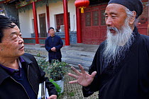 Tao Grand Master Rinfarong, explaining about Taoism for us, at the Louguantai temple, Xian, Shaanxi, China. This temple is where Lao Tze wrote the Tao Te Ching.