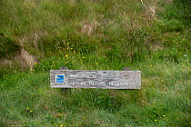 Sign welcoming visitors to RSPB&#39;s Fetlar Nature Reserve, Fetlar, Shetland, Scotland, UK. June 2018.
