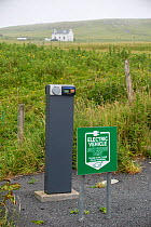 Electronic vehicle charging point in remote location, Fetlar, Shetland, Scotland, UK. June 2018.