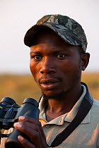 Shoebill (Balaeniceps rex) conservationist Elijah Mofya, Bengweulu swamp. Zambia