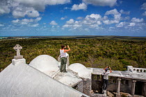 Scientists Nathan Cooper and Chris Fox looking out over Mount Alvernia / Como Hill - the highest point in the Bahamas. They are looking out on Kirkland&#39;s Warbler habitat. Cat Island, Bahamas.